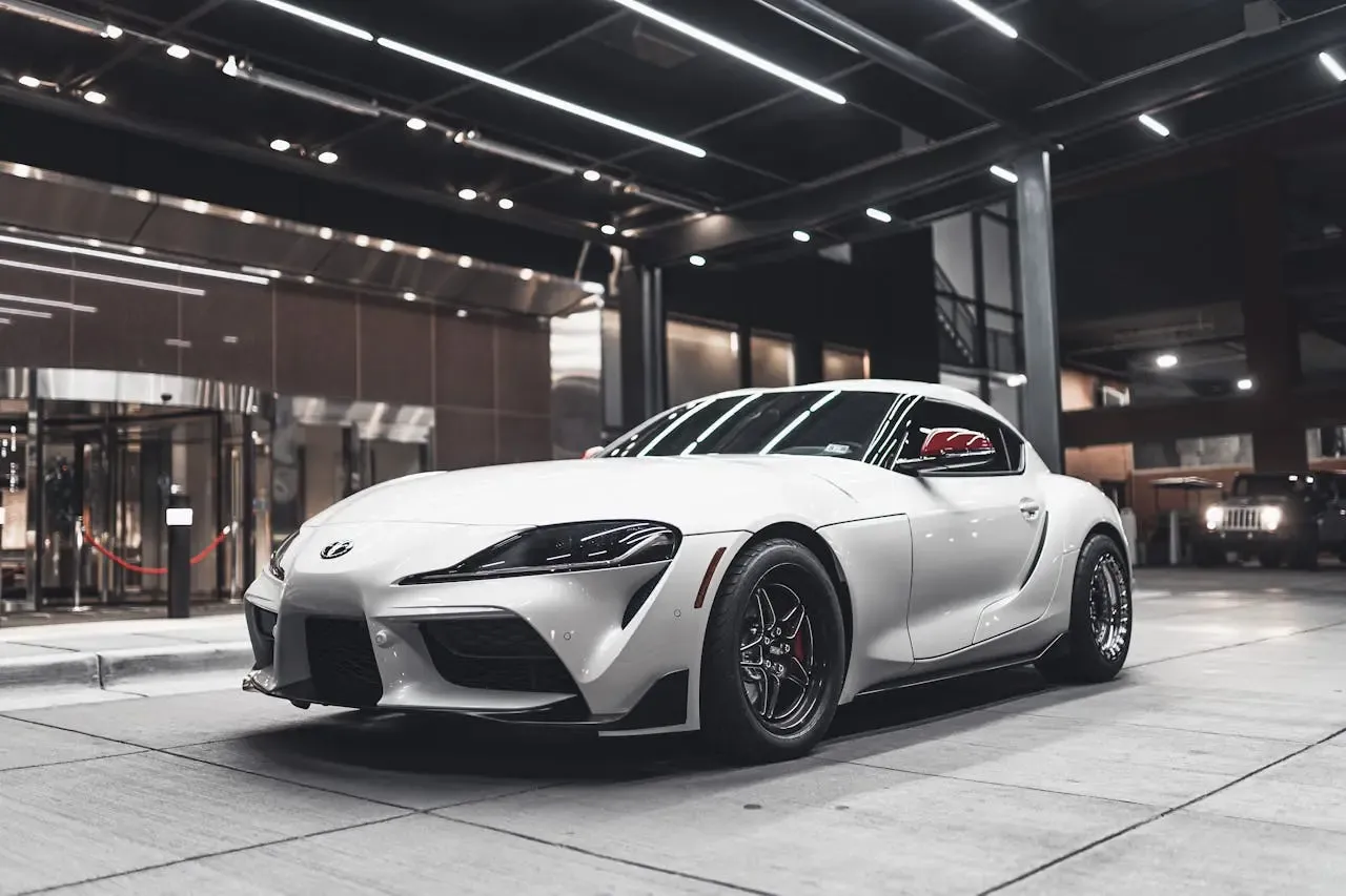 white toyota supra showing off its freshly dark tinted windows